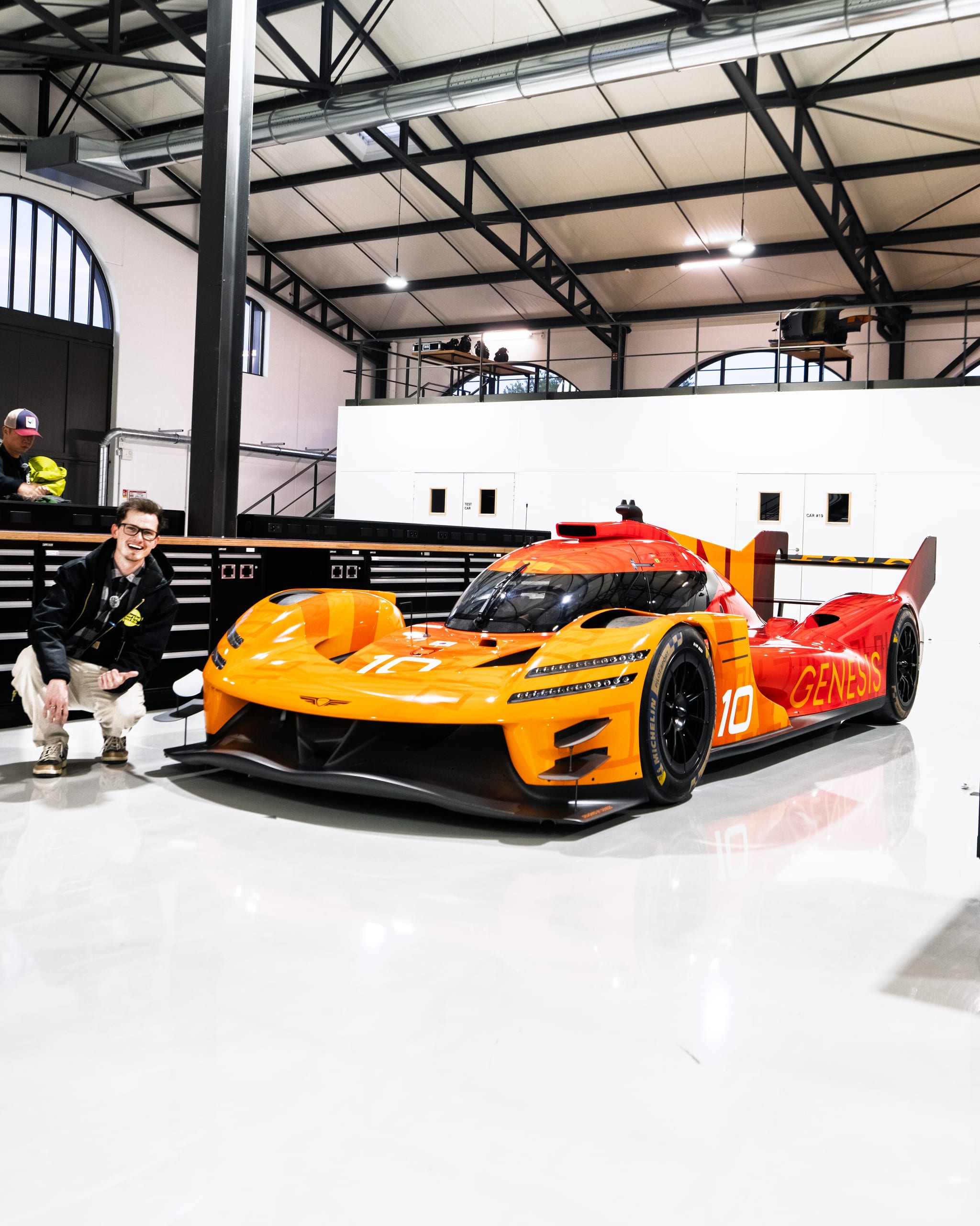AlexMartini capturing content alongside the Genesis GMR 001 on the Paul Ricard track